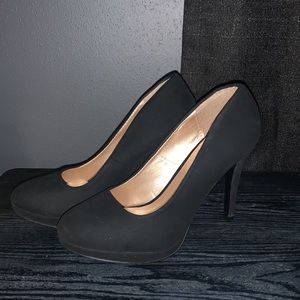 Black suede pumps